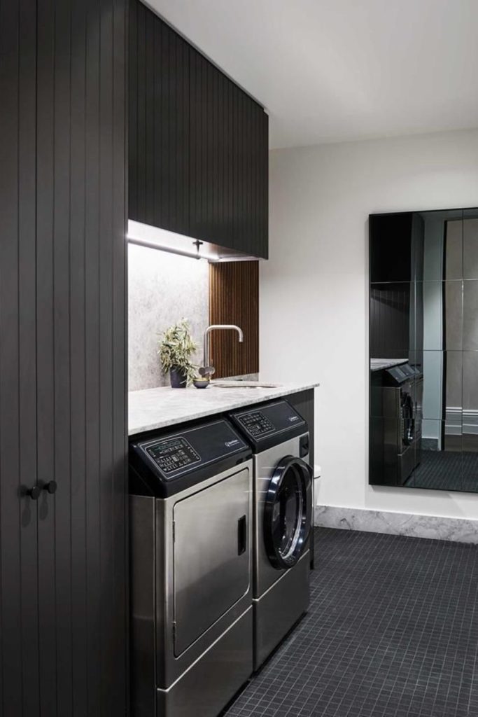 Contemporary laundry room black cabinets geometric