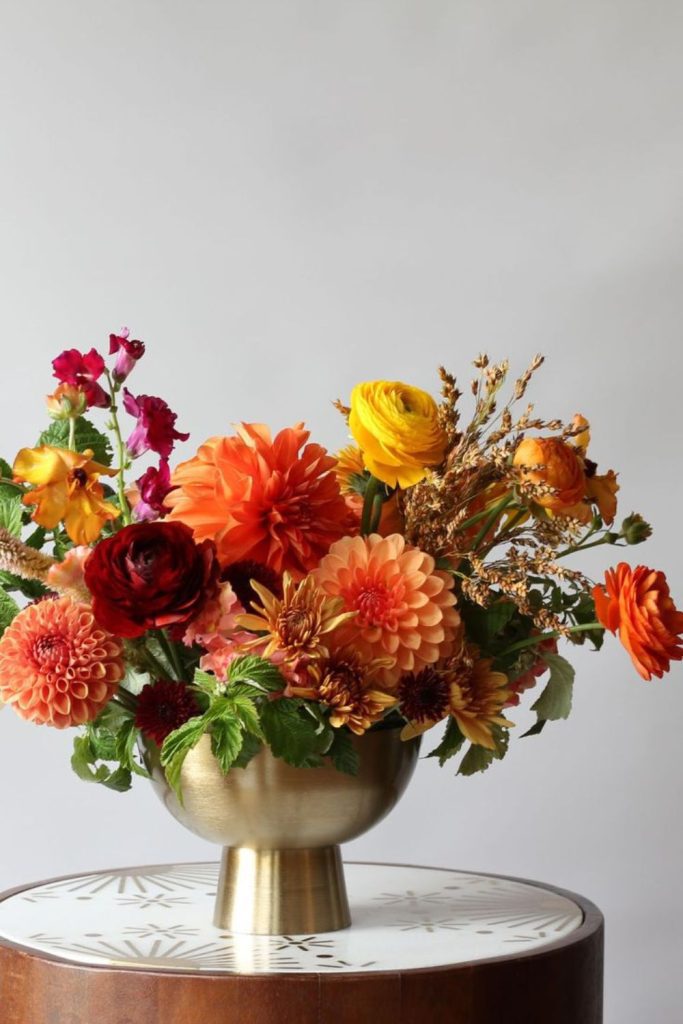 Burnt sienna dahlias with golden sunflowers