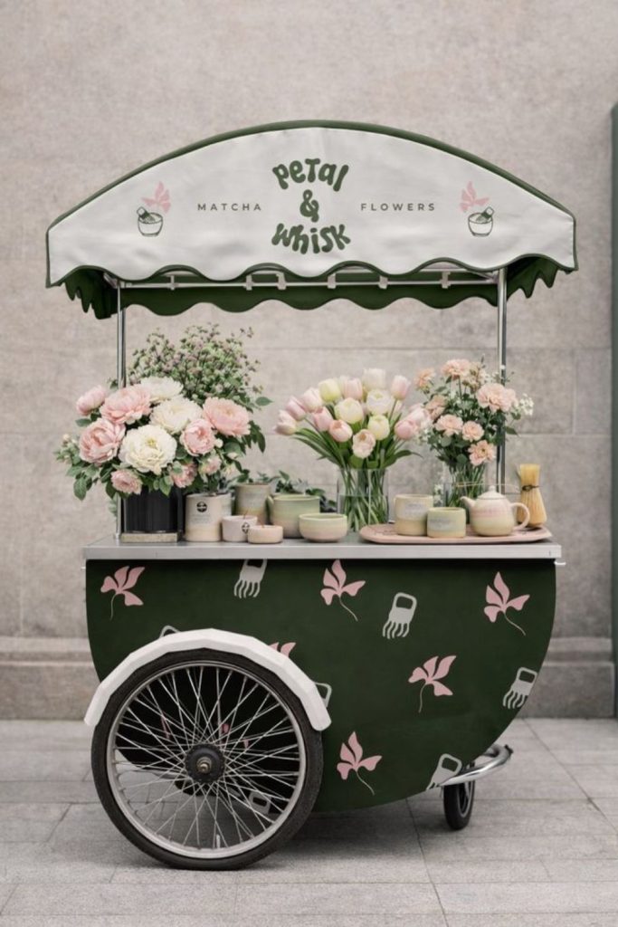 Coral tulips atop sun-bleached wooden crates