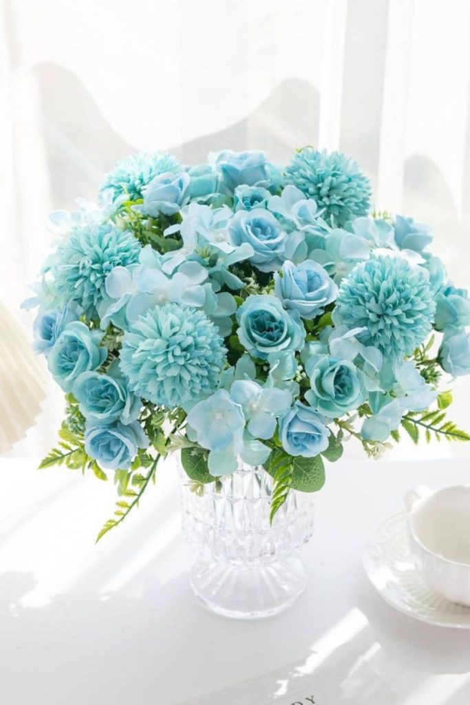 Ice-blue roses with frosted accents