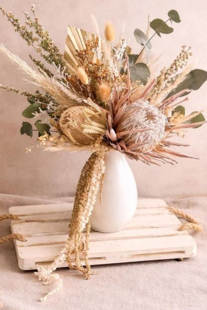 Sandy proteas with dried pampas grass