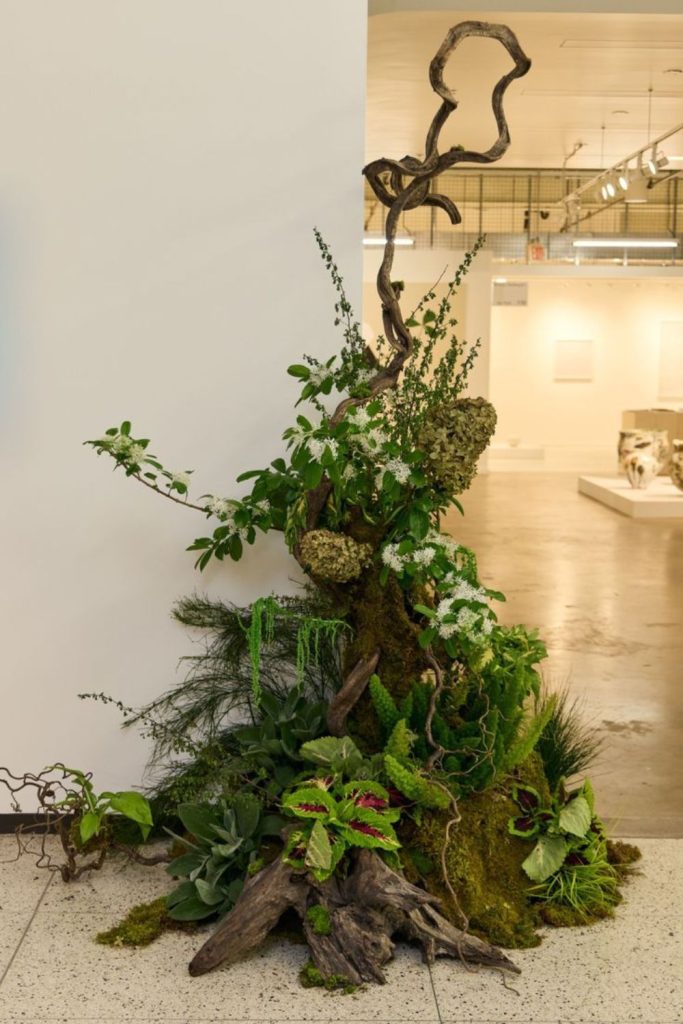 Moss leaves muted woodland arrangement