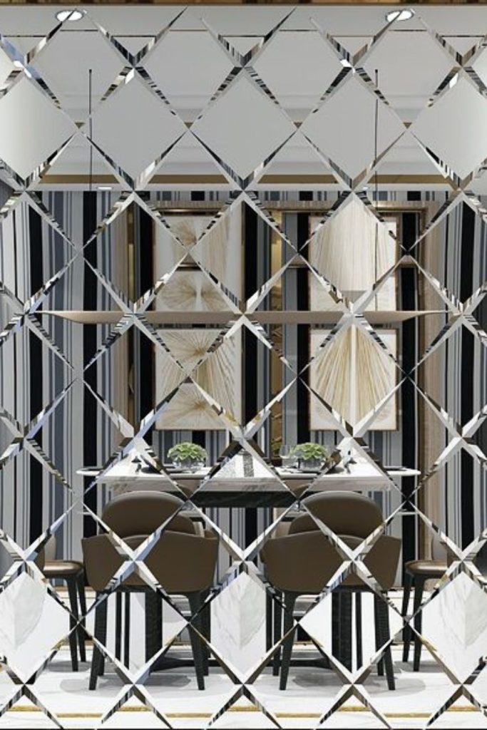 Jagged mirrored mosaic reflecting dramatic light.