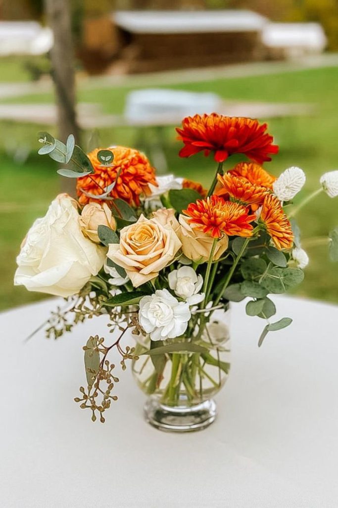 Orange-red ginger with white chrysanthemums