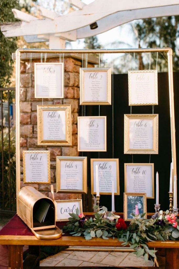 Hanging frames gallery style seating chart display.