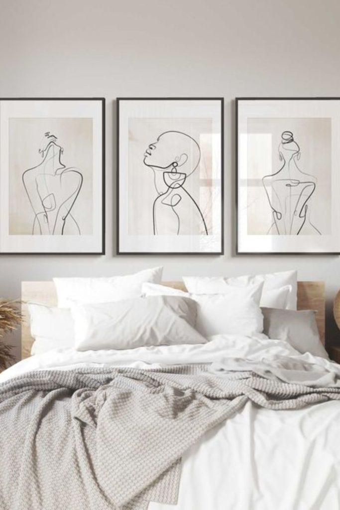 Black lines coil across beige linen