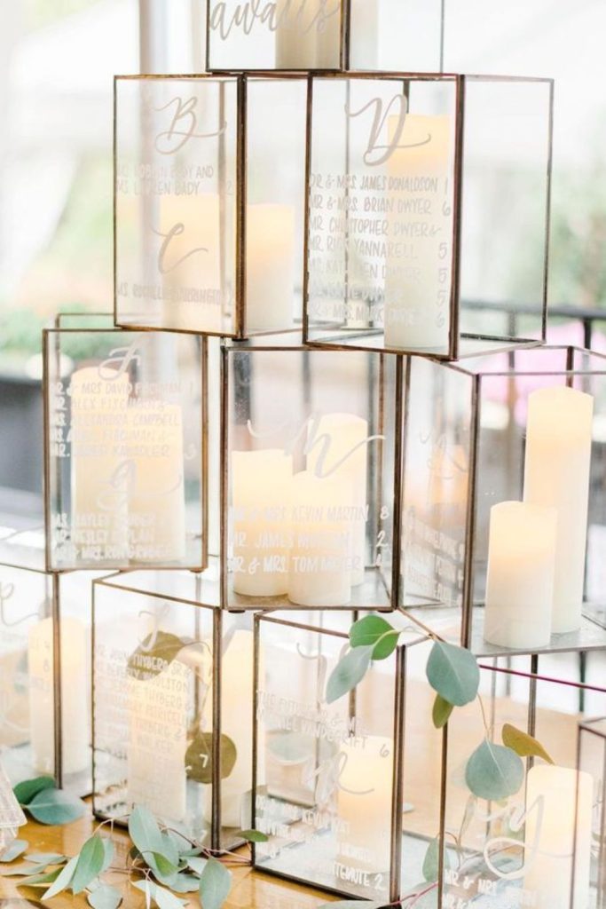 Lantern pathway glowing wedding seating chart display.