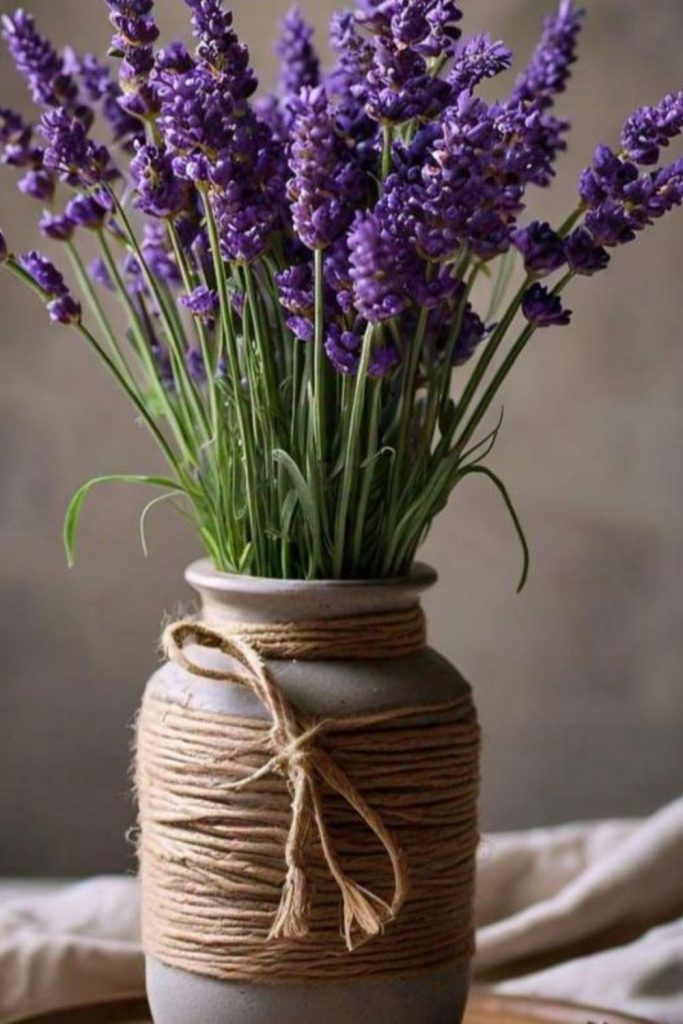 Purple lavender stems in clay container
