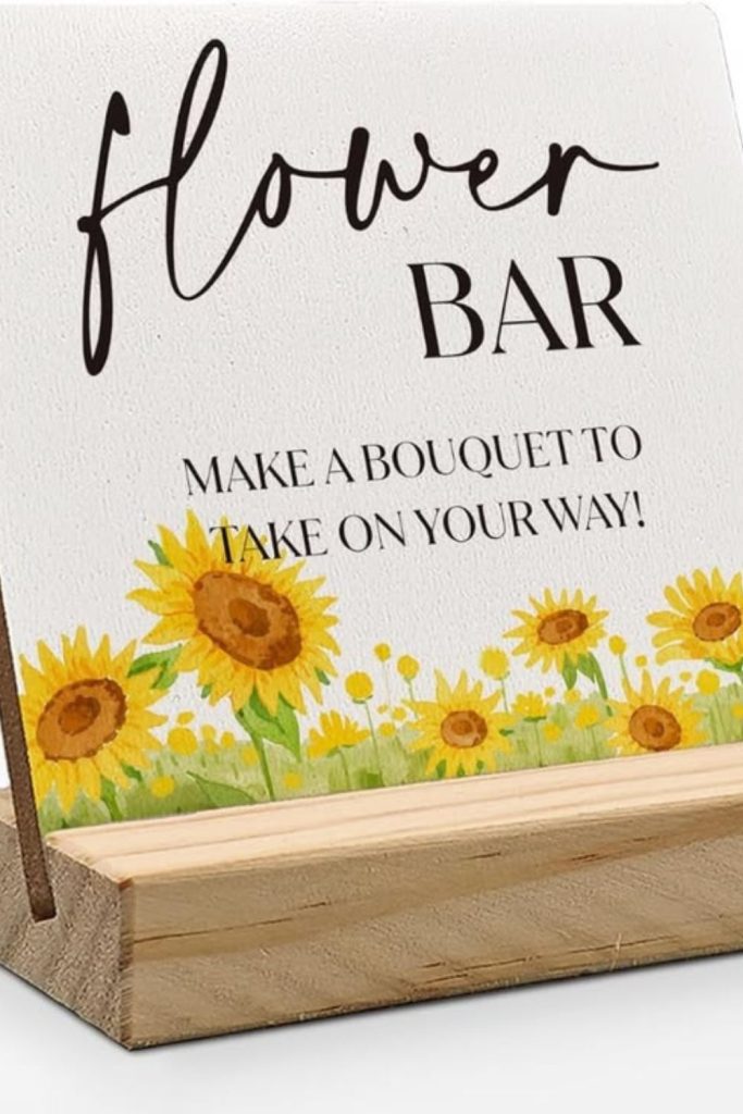 Orange marigolds exploding unevenly over planks