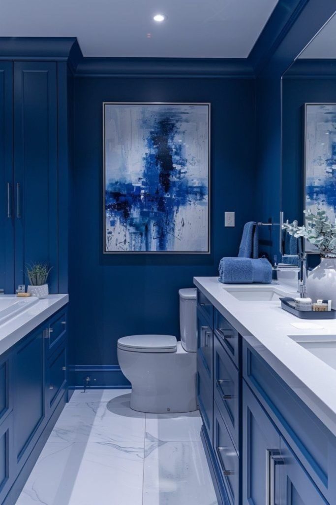 “Deep blue bathroom with reflective surfaces”