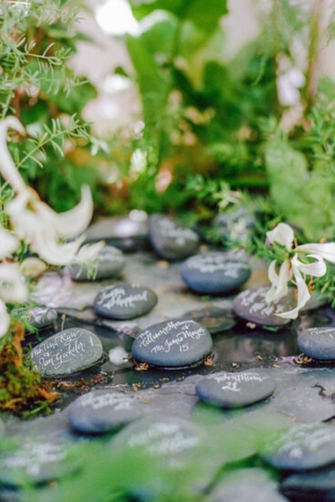 Engraved stone minimalist natural seating chart display.