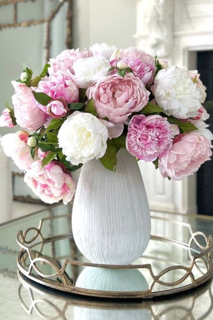 Pastel peonies in ceramic vase
