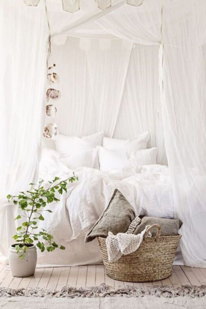 White billowing linens gray icy rugs
