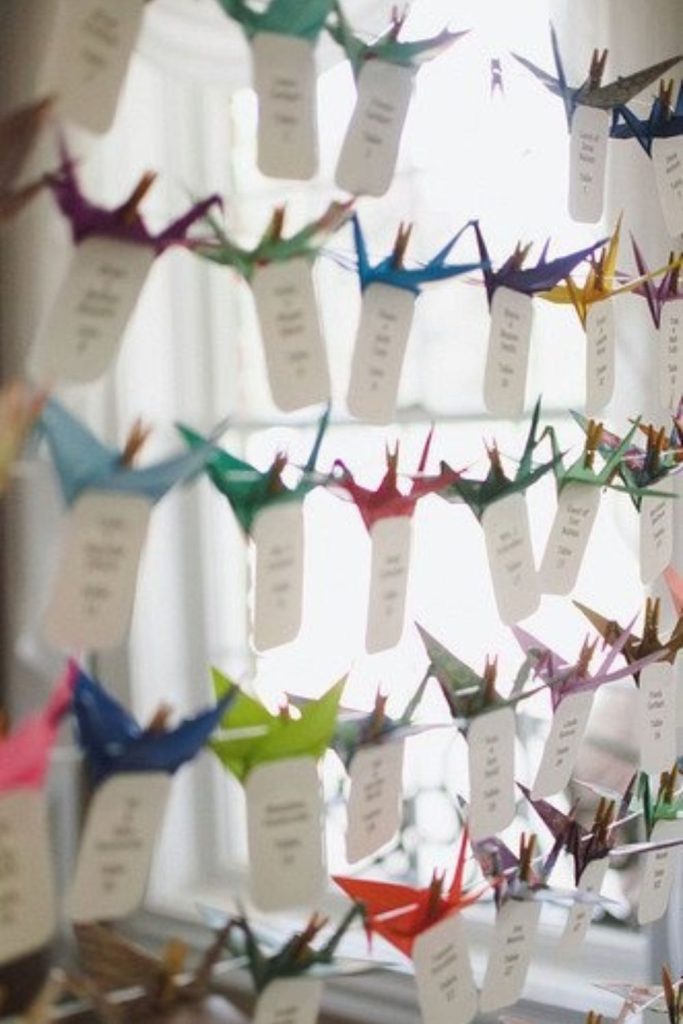 Origami paper hanging artistic seating chart design.