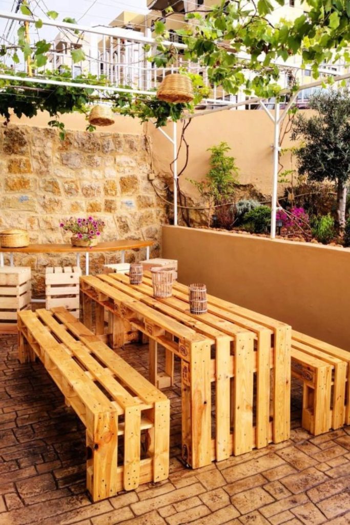 Outdoor pallet desk with sunlit workspace