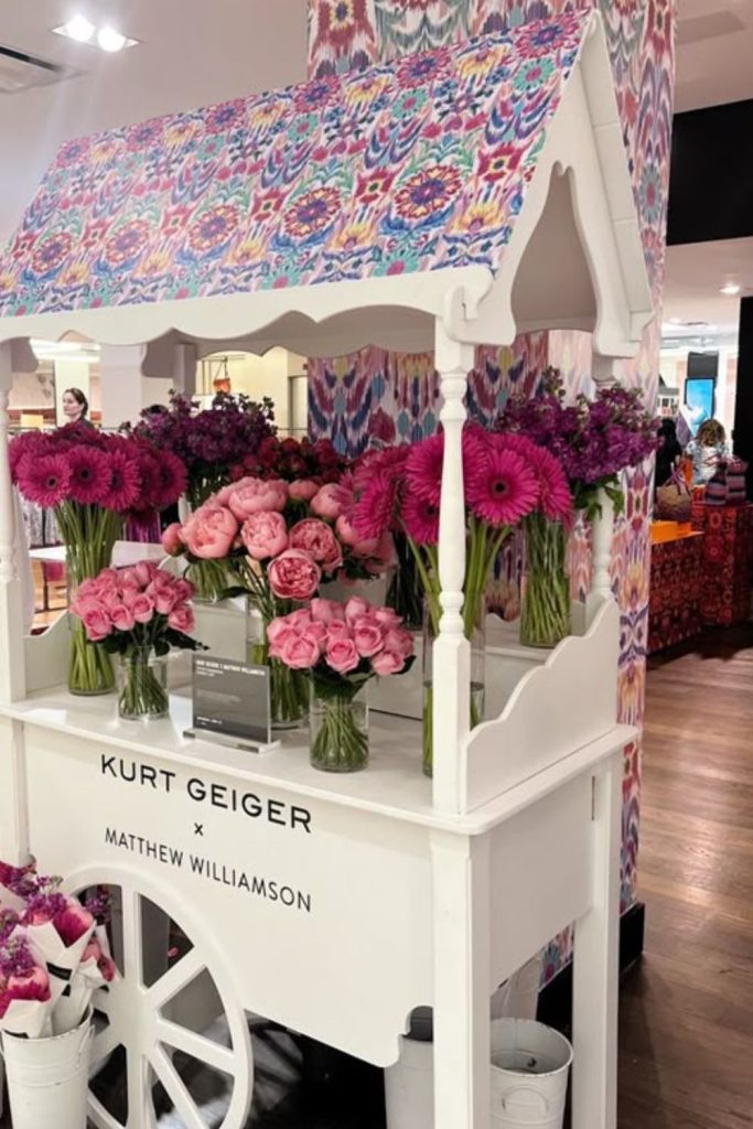 Deep plum blossoms over uneven wooden crates