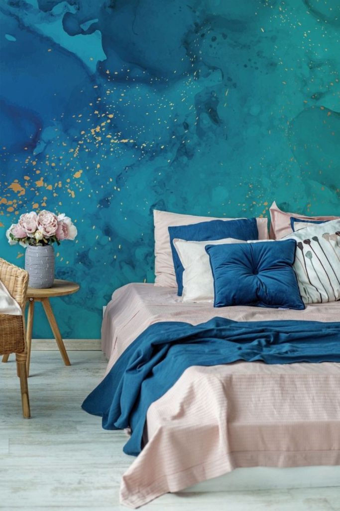 Turquoise shards explode across sandy backdrop