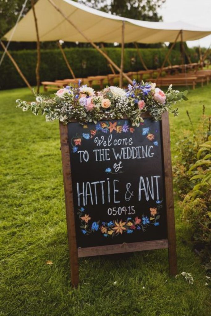 Hand-drawn chalkboard with rustic whimsical design.
