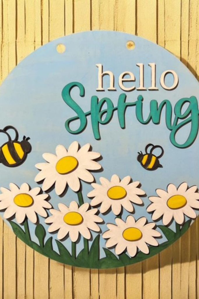 Flowers and clay bees on hoop