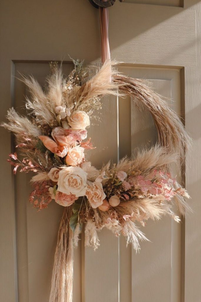 Mixed feathers, flowers, and ribbon hoop