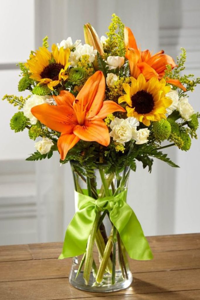 Golden daisies orange tulips rustic