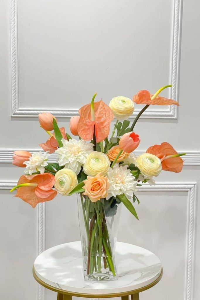 Coral peonies with amber tulips arrangement