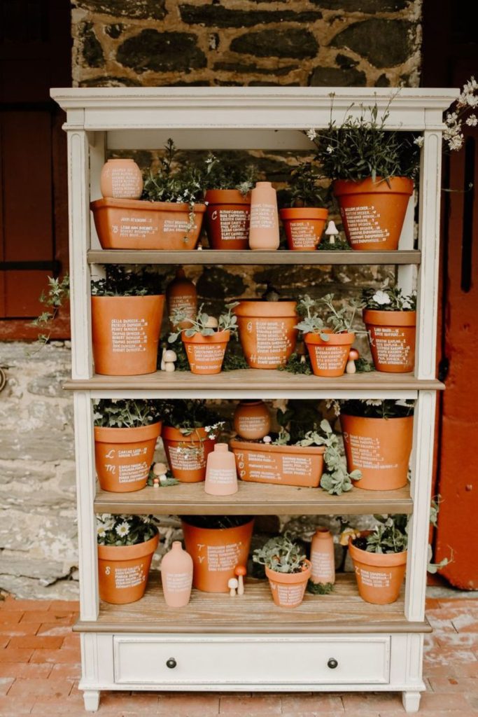 Herb pots eco friendly seating chart display.