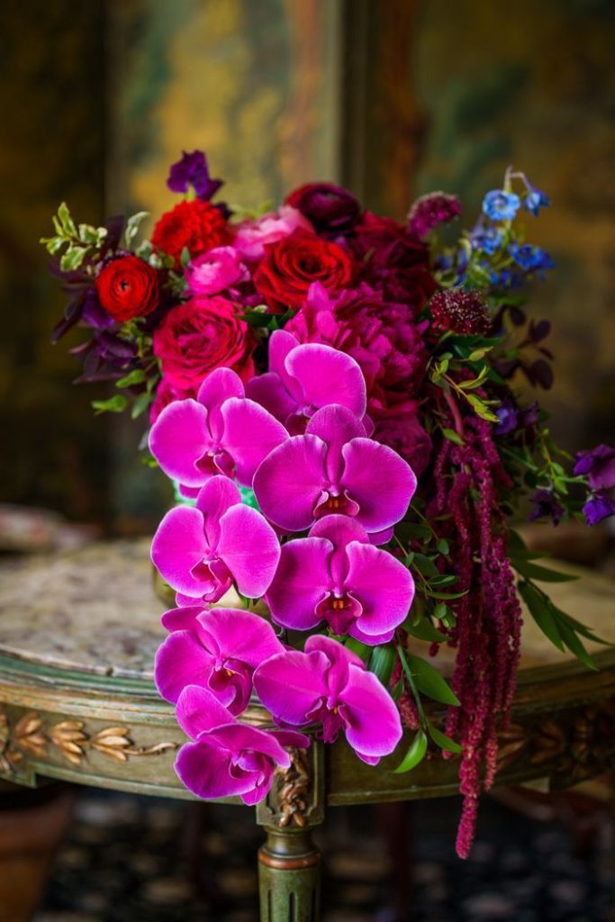 Magenta orchids with lilac sprigs cascade