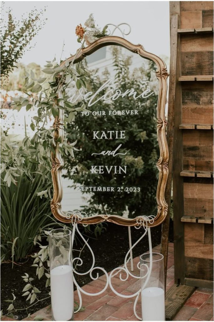 Antique mirror with delicate reflective lettering.