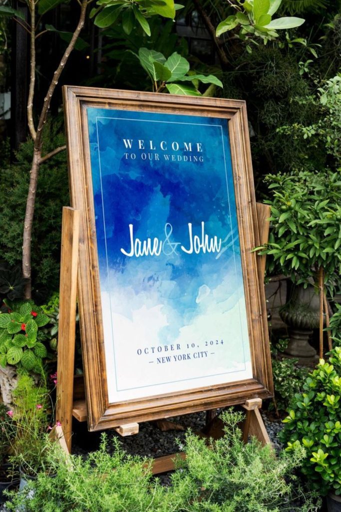 Soft watercolor painted wedding entrance sign.