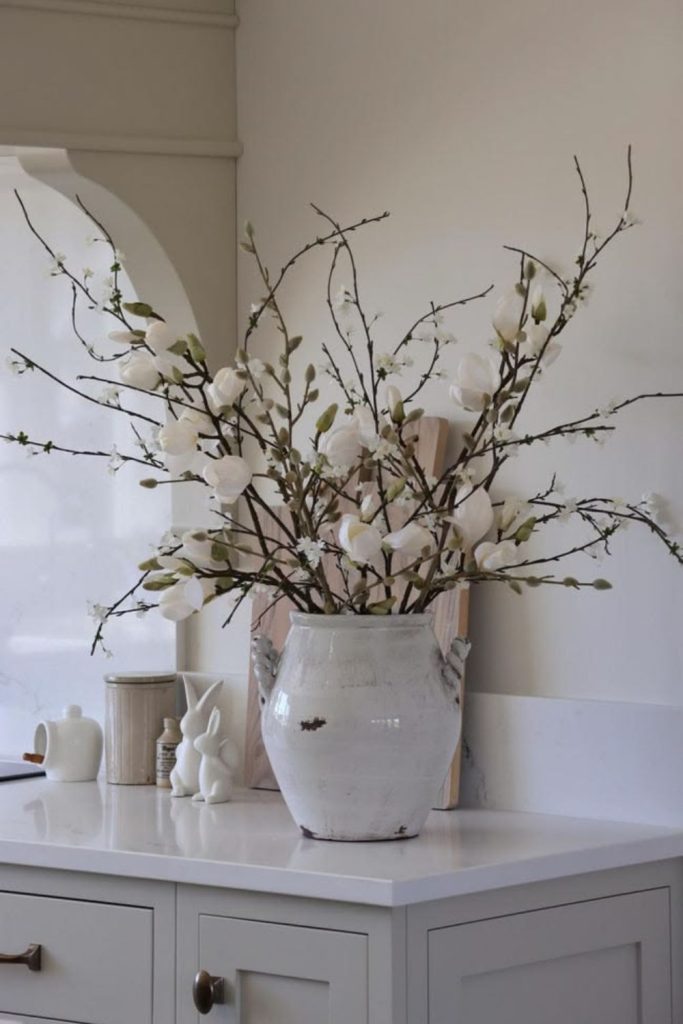 Drooping willow leaves in ceramic bowl