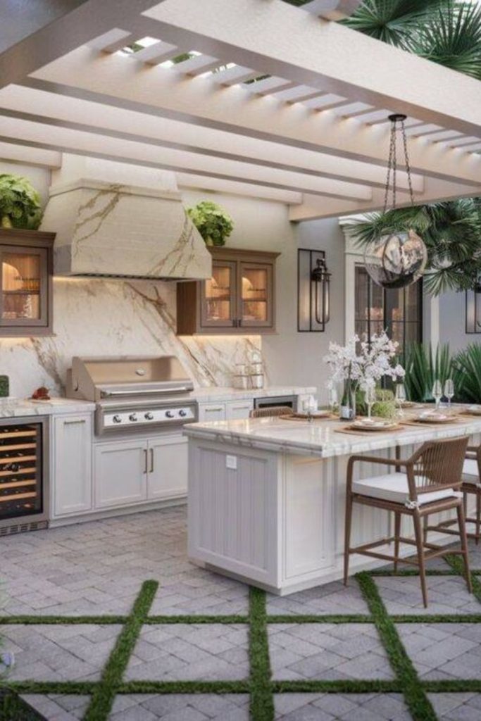 Marble counters beneath vine-covered pergola