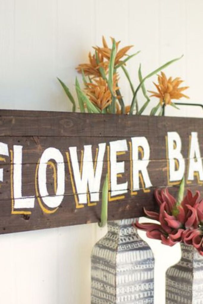 Wildflowers erupting chaotically over rustic wood