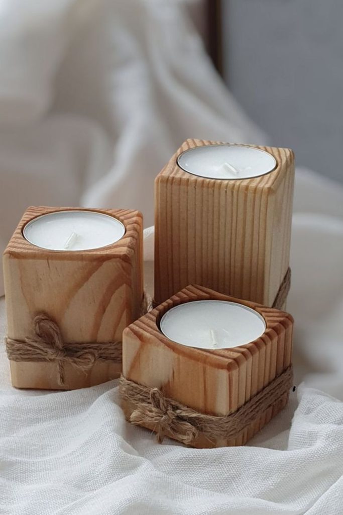 Trio of rustic wooden candle holders
