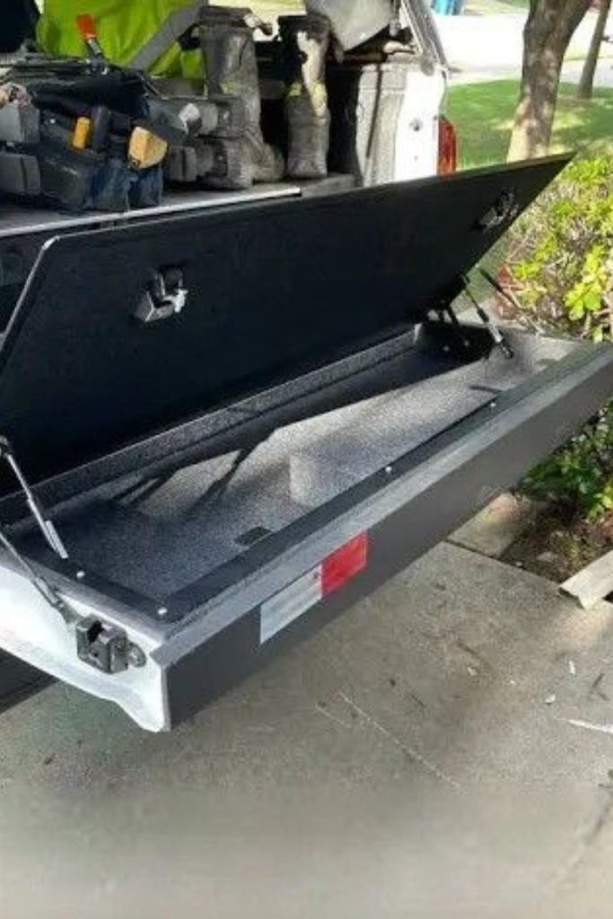 Fold down ramp hidden truck bed storage slot
