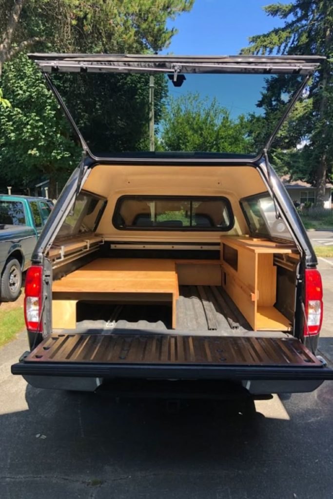 Foldable side shelf panels truck bed storage