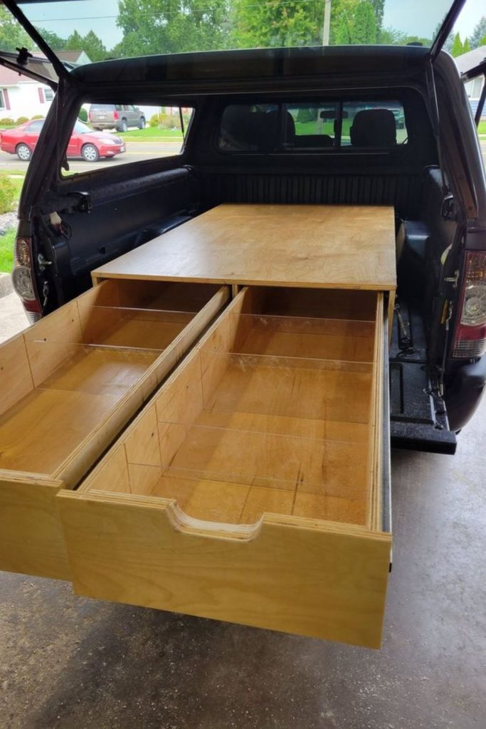 Sliding firewood rack truck bed system