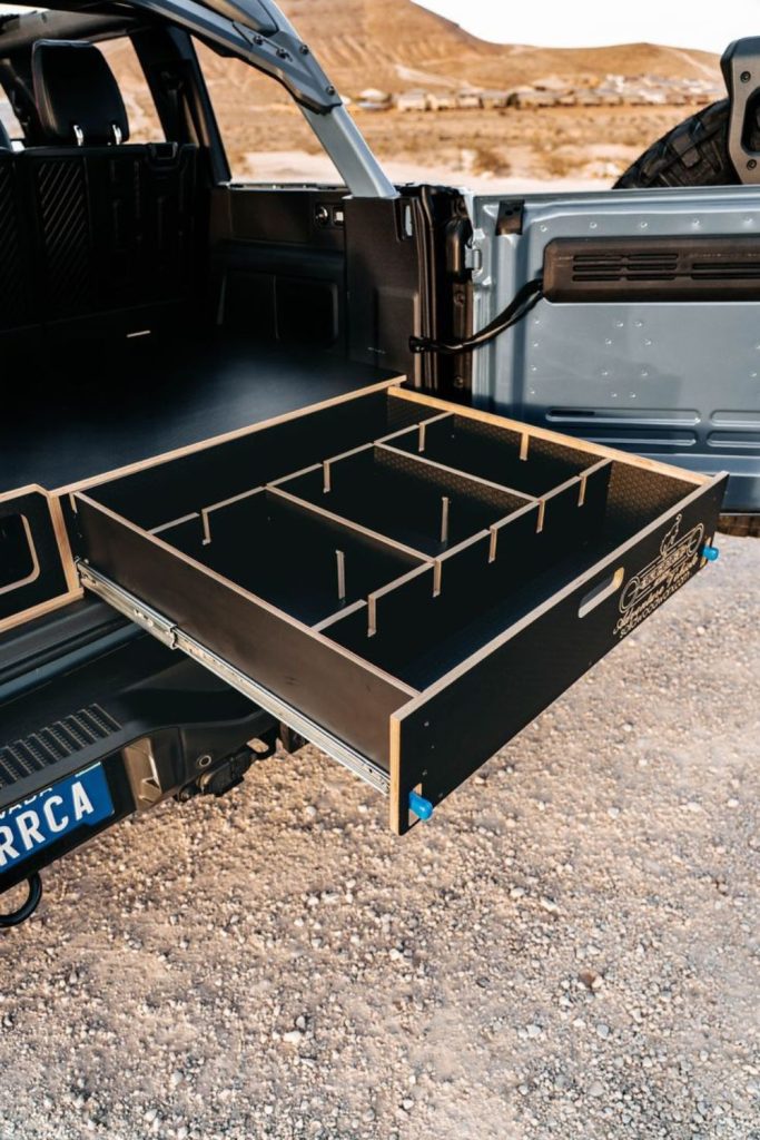 Tailgate hidden compartment storage shelf design
