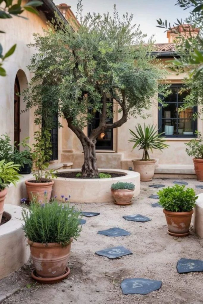 Mediterranean gravel courtyard front yard