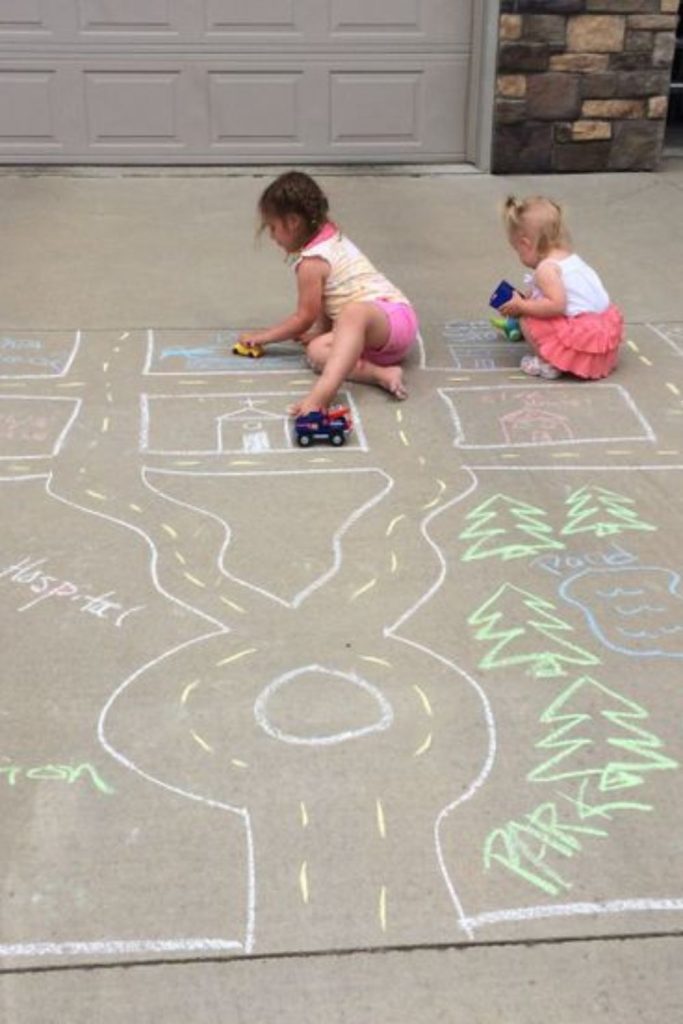 Chalk road city kids toy car backyard drawing map