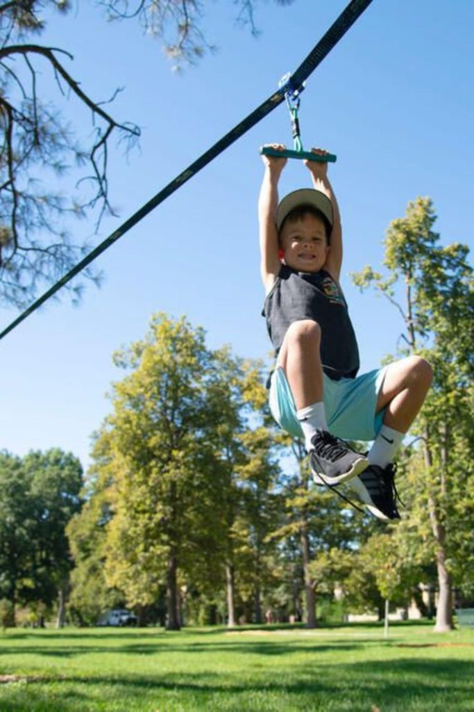 Backyard mini zip line kids play.