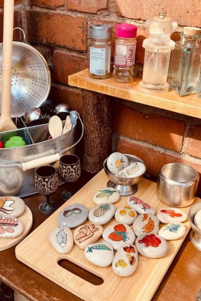Pebble potion mud kitchen jars setup