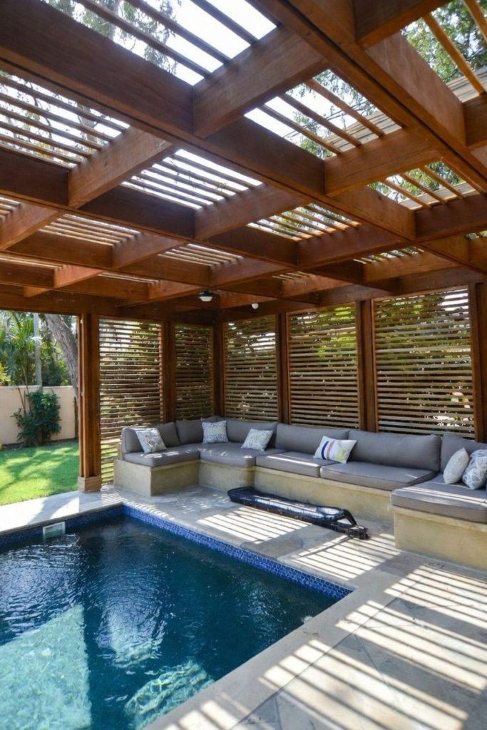 Pergola shaded pool, relaxed cozy semi covered outdoor space.