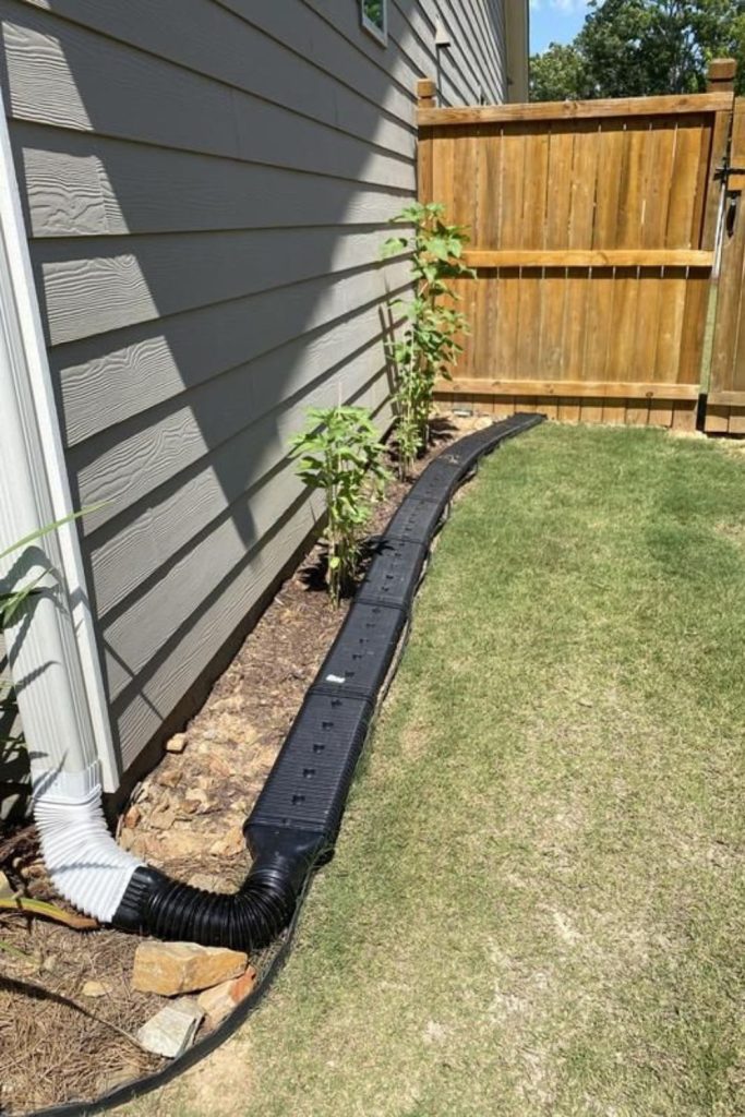 Pop up emitter drainage outlet system