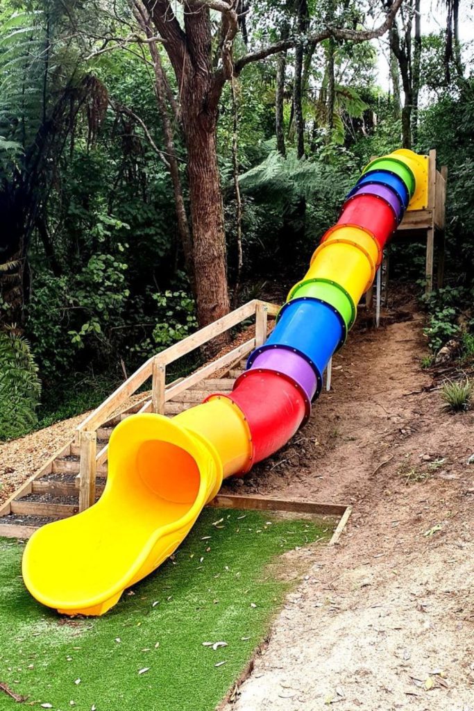 Rainbow slide backyard kids colorful play hill.