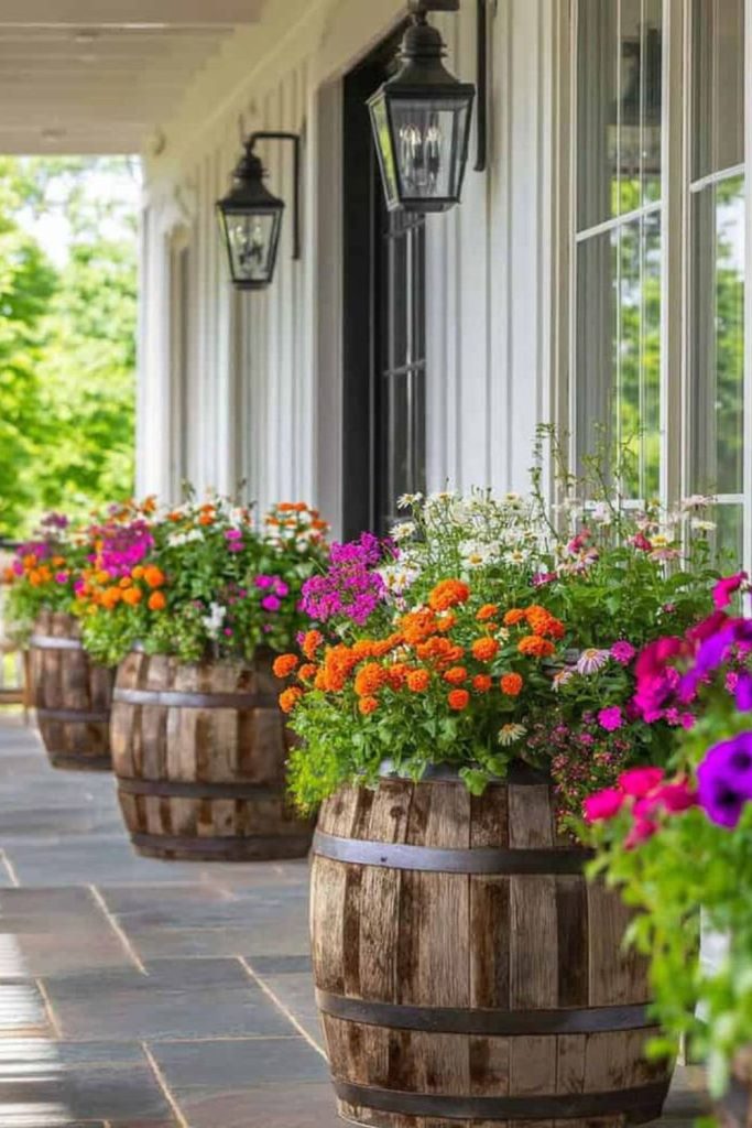 Rustic barrel flower pot porch display.