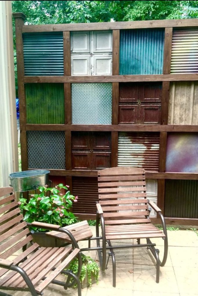 Tin can mosaic fence art