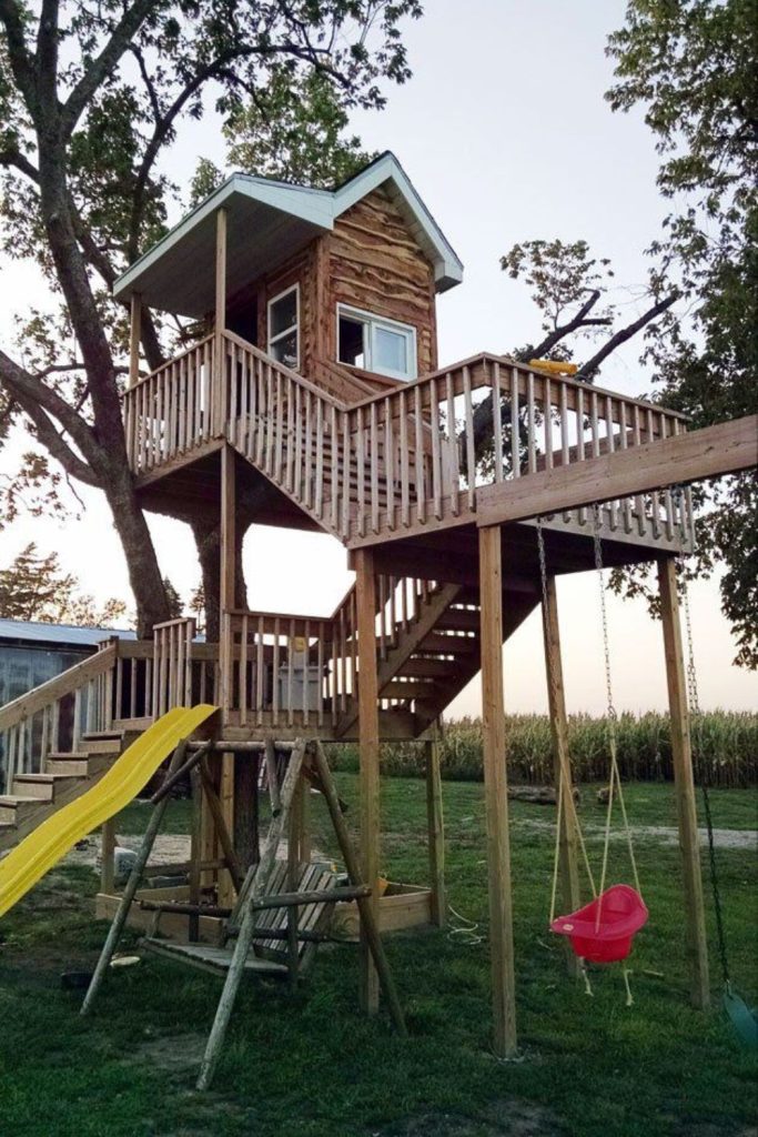 Treehouse elevated backyard kids wooden retreat space.