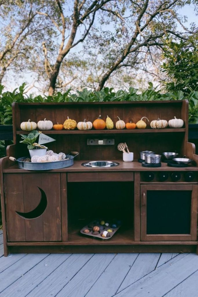 Lantern lit evening mud kitchen setup