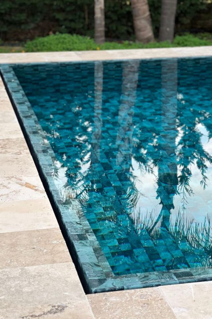 Colorful broken tile splash pool deck